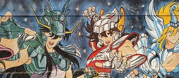 Imagem: Foto do muro mostrando Shiryu, Seiya e Hyoga.